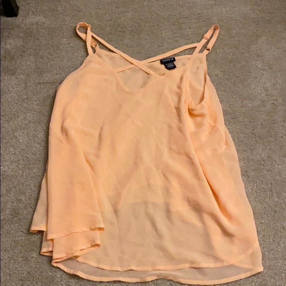 A very cute peachy cross cross top